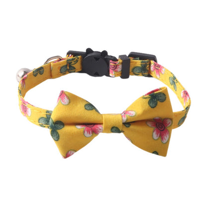 Close-up of Mokka floral bow tie cat collar showing adjustable strap and breakaway clasp