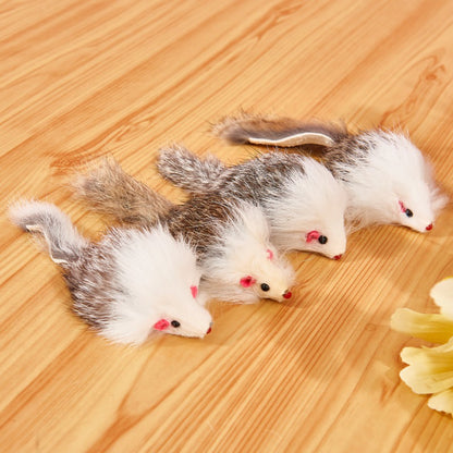Close-up of Moo faux fur mouse cat toy in light brown with pink ears and tail