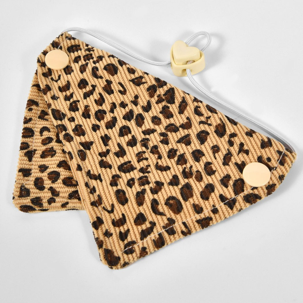 Mokka Wild Print Pet Bandana Collar displayed on a wooden surface