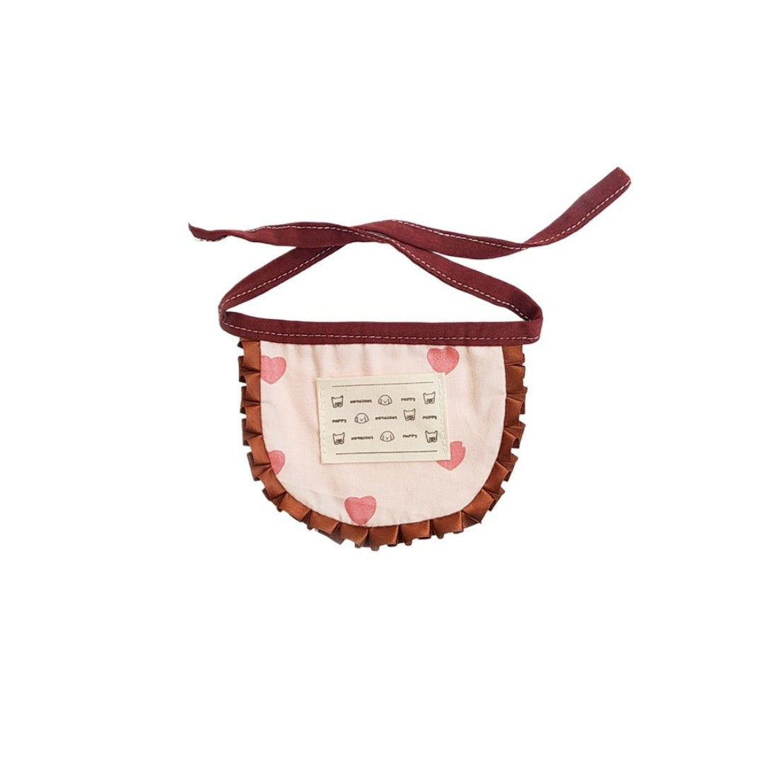 Side view of Mokka printed ruffle cat bib on a cat, showing adjustable strap