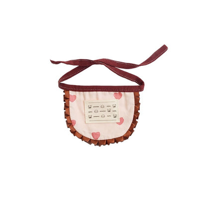 Side view of Mokka printed ruffle cat bib on a cat, showing adjustable strap