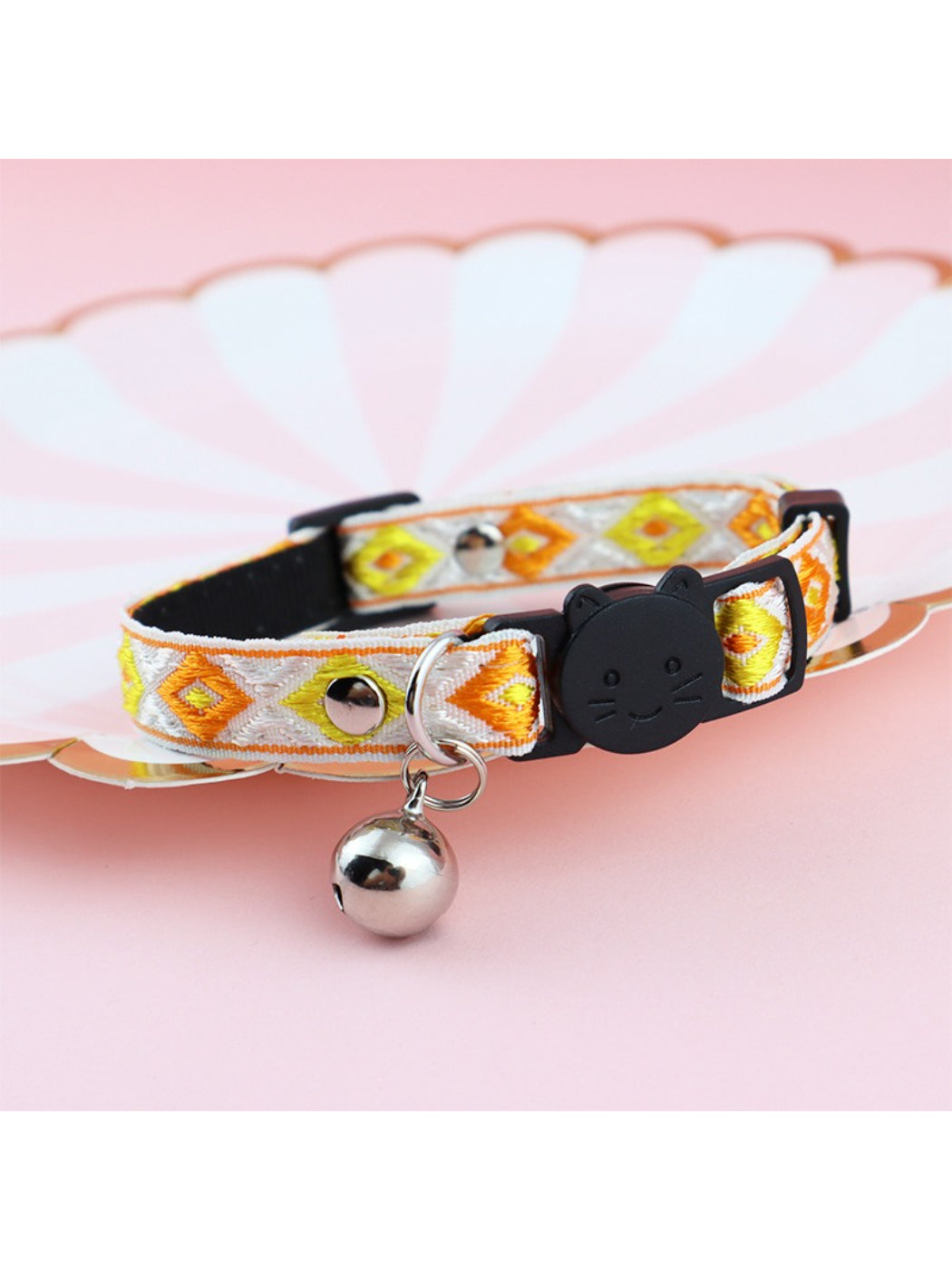 Mokka diamond weave bell cat collar worn by a cat, showing fit and bell placement