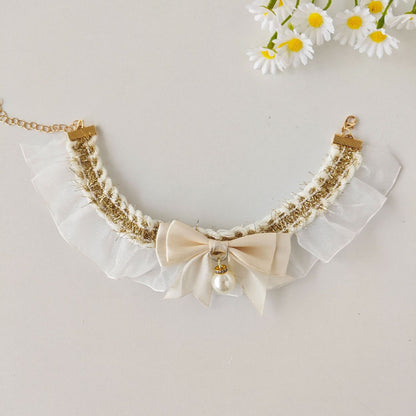 Close-up of lace bow charm detail on Mokka cat collar