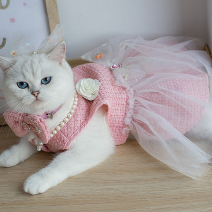 Close-up of the pink tulle fabric and bow detail on the cat dress