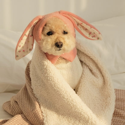 Ozzie pet hat positioned on a flat surface with neutral background