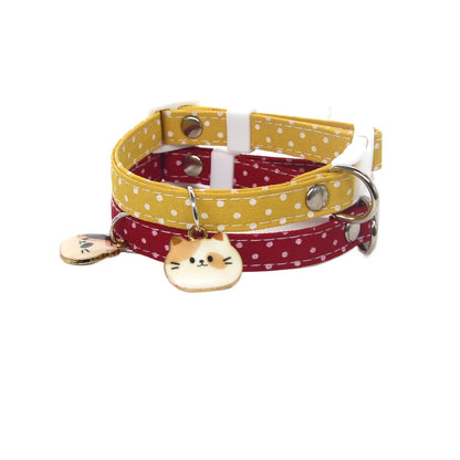 Mokka cat face charm on a pink breakaway collar with a bell