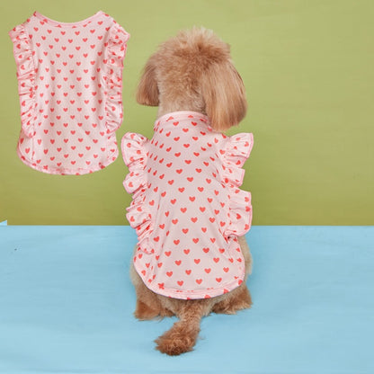Back view of Ozzie dog wearing white t-shirt with red hearts and ruffle details on sleeves