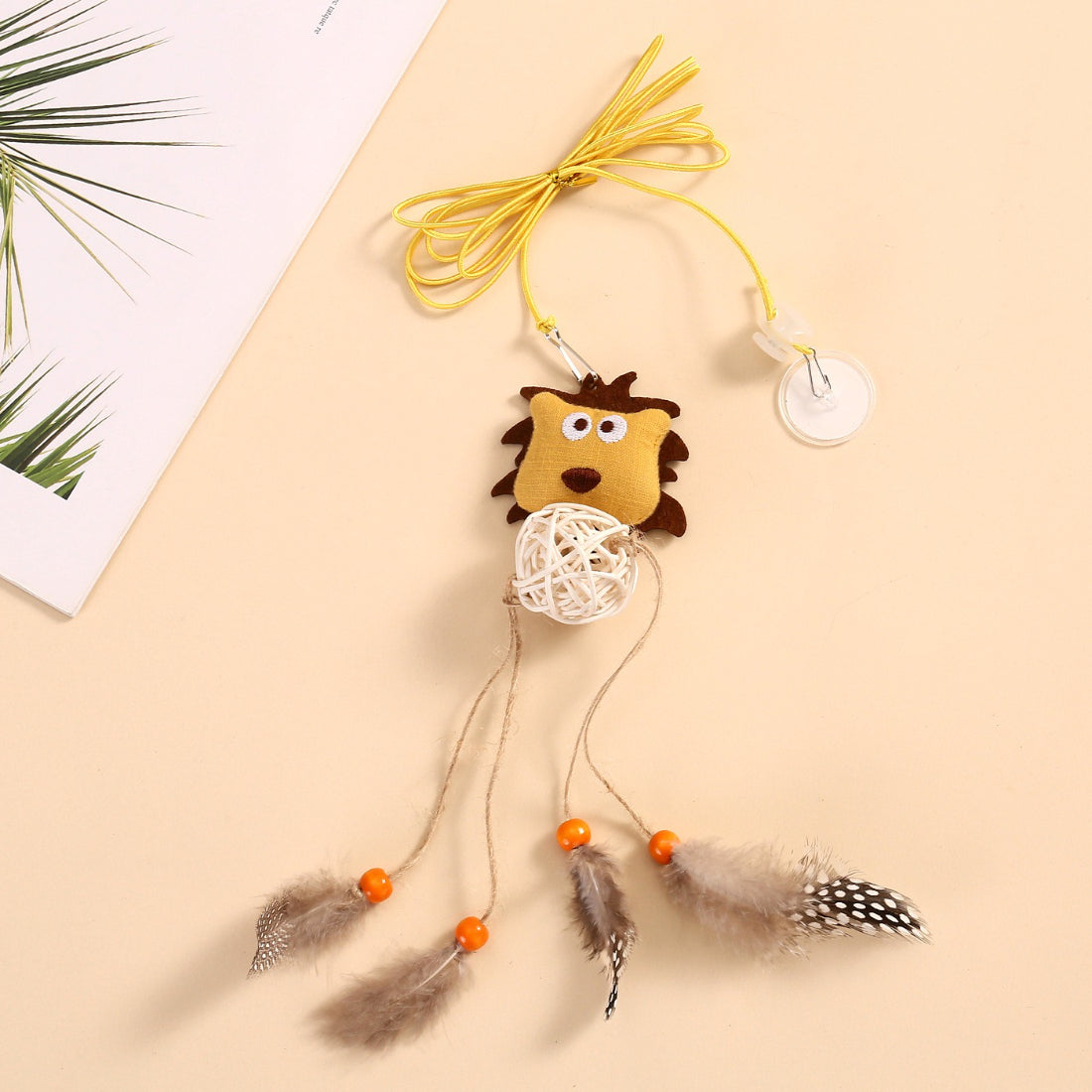 Moo Lion hanging cat toy with soft plush lion head and feather teaser attached
