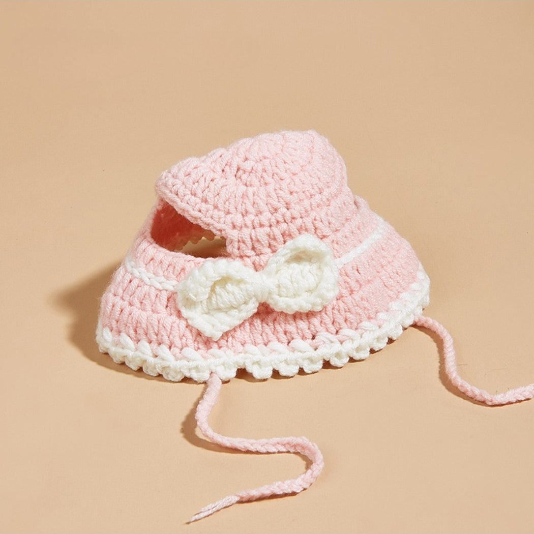Side view of Ozzie pink crochet cat hat highlighting cat ear design