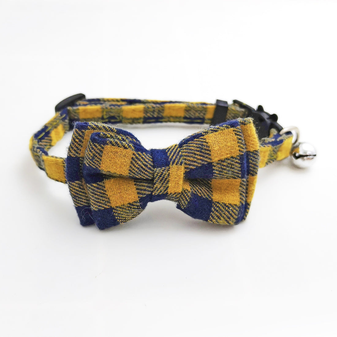 Cat wearing Mokka check bow tie collar sitting on wooden floor