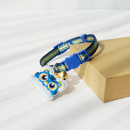 Close-up of Mokka cat collar with tiger head charm showing intricate design