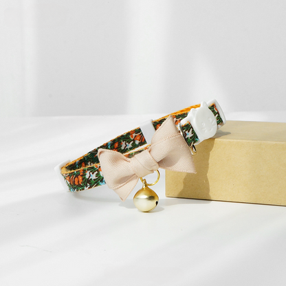 Mokka cat collar with floral design coiled to display flexibility