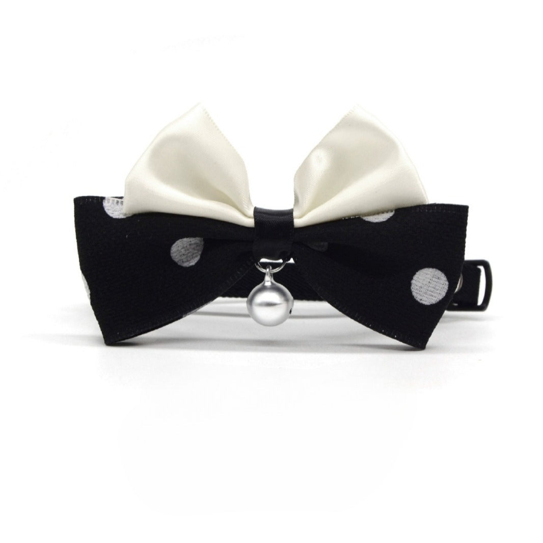 Mokka cat collar with polka dot bow displayed on a white background