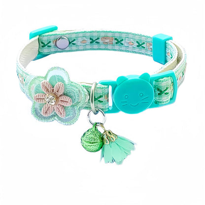 Mokka Floral Charm Cat Collar coiled to show floral pattern and bell