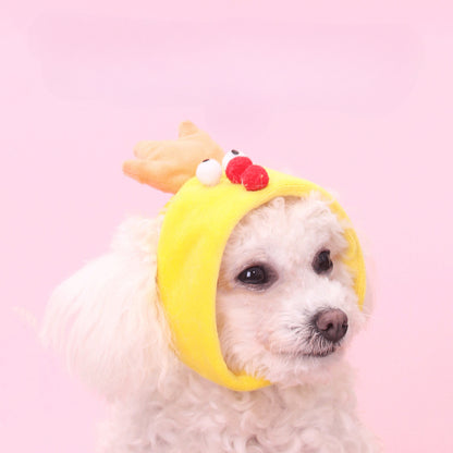 Yellow chick shape pet hat displayed on a white surface