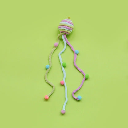 Close-up of Moo interactive toss cat toy showing vibrant colors and playful design