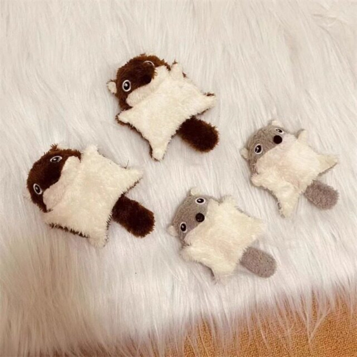 Close-up of plush squirrel kicker cat toy showing textured fur and stitched eyes