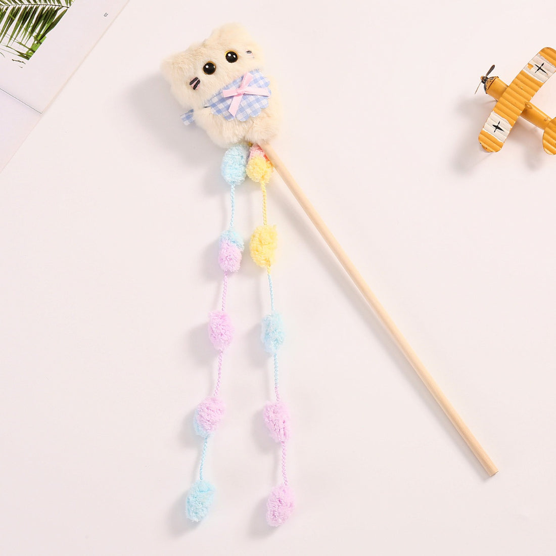 Moo plush cat teaser wand toy displayed on a white background highlighting colors and design