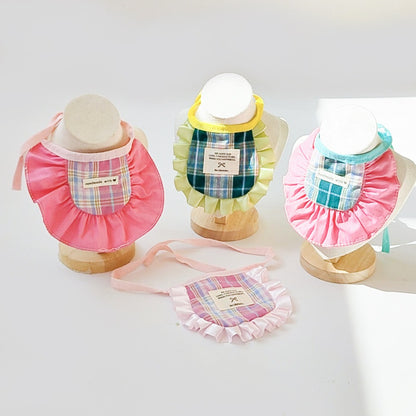 Mokka plaid ruffle cat bib displayed flat showing red and white check pattern