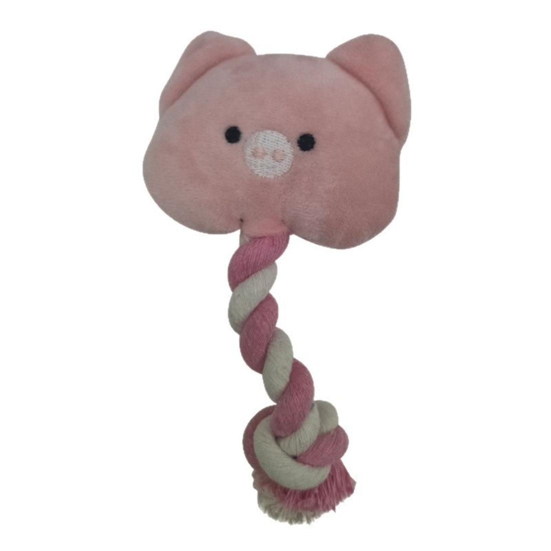 Dog playing with pink pig rope toy, gripping it in its mouth
