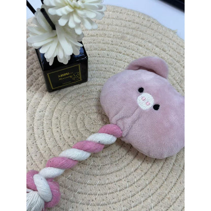 Pink pig rope dog toy displayed on white background showing full length