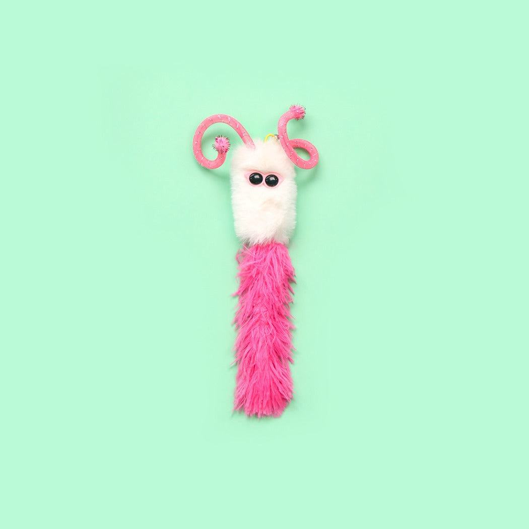 Moo interactive fuzzy character toss cat toy displayed from a side angle