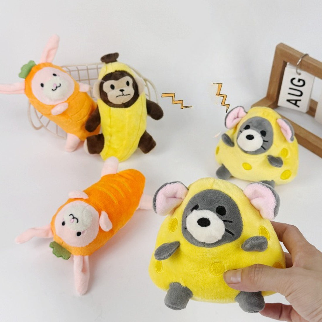 Close-up of Petkin plush dog toy featuring a cartoonish animal face with stitched eyes