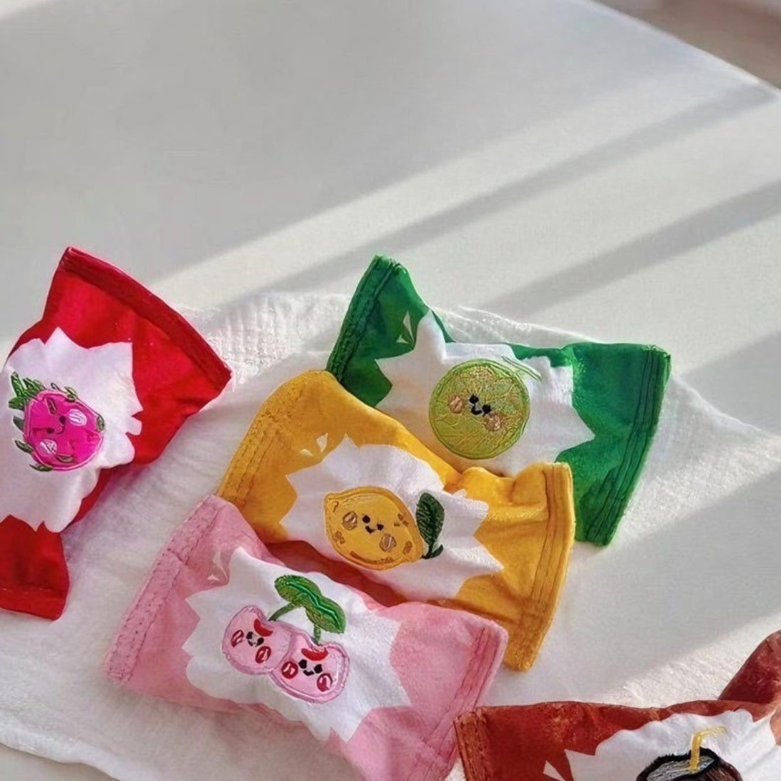 Snuffy Fruit Snack Snuffle Bag with colorful fruit pattern on a white background