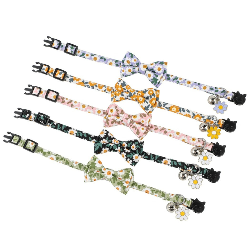 Mokka floral bowtie cat collar laid out with bowtie centered and strap extended