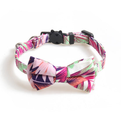 Side view of cat wearing Mokka Tropical Leaf Bow Tie Cat Collar with bell