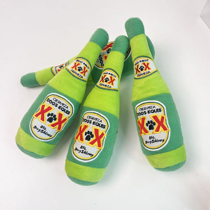 Petkin plush dog beer toy held in hand showing size and texture