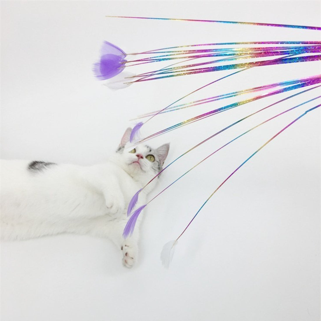 Side view of Moo Ribbon Feather Cat Teaser Wand showing colorful feather and ribbon design