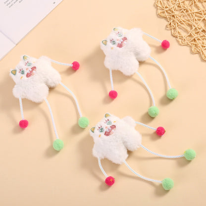 Moo plush cat toy with pom poms displayed on a white background