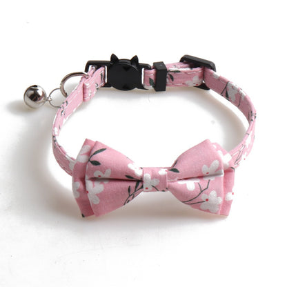Mokka floral cat collar with bow tie wrapped in a circular shape