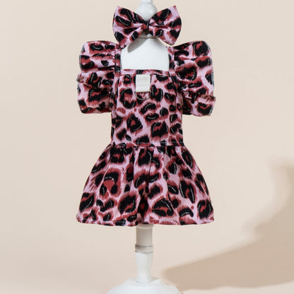 Close-up of the leopard pattern fabric and bow detail on the dog dress