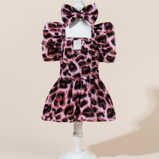 Close-up of the leopard pattern fabric and bow detail on the dog dress