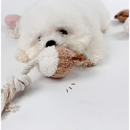 Petkin animal plush dog toy with rope tail displayed from side angle
