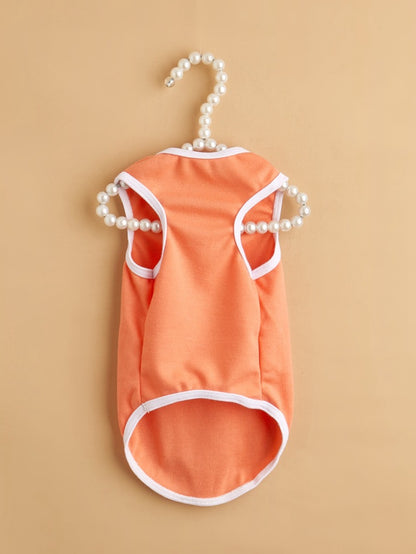 Ozzie smiley print dog tank top showing neckline and armholes