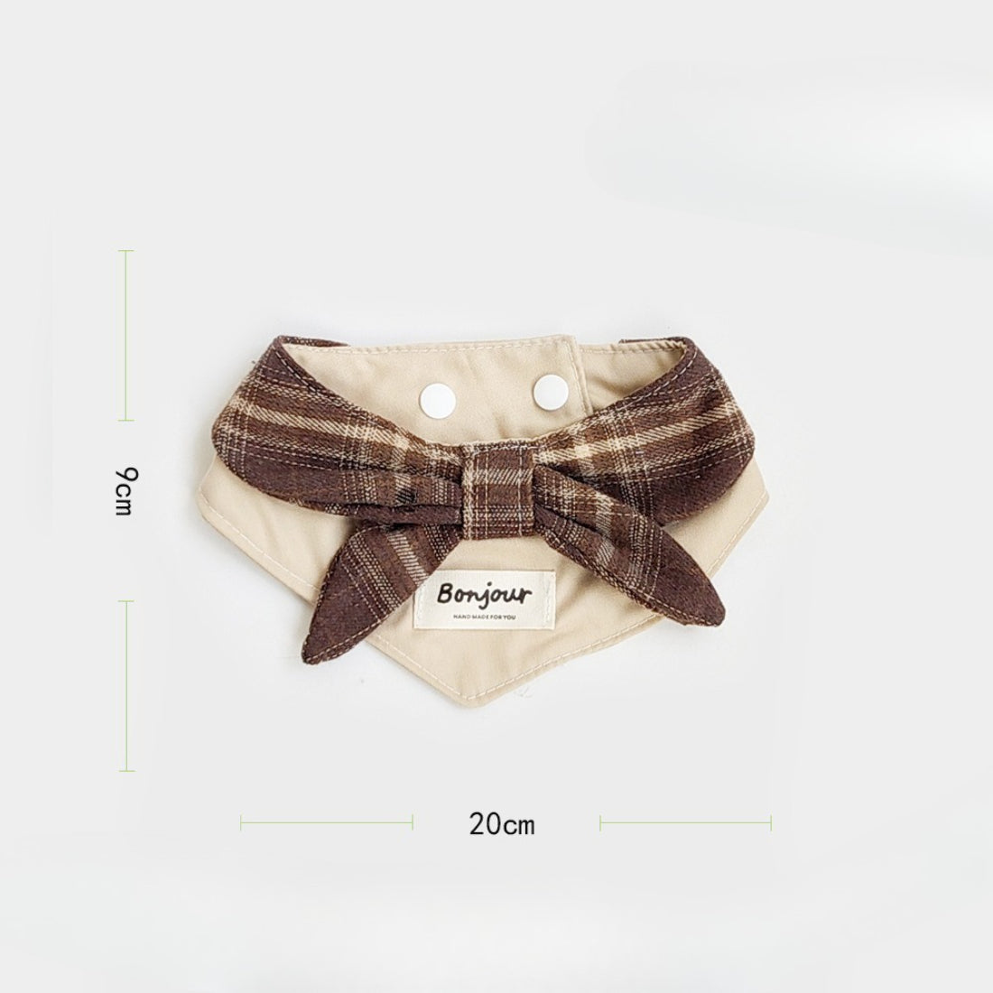 Side view of brown ruffle cat bib showing strap and ruffles
