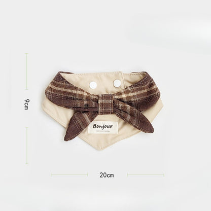 Side view of brown ruffle cat bib showing strap and ruffles