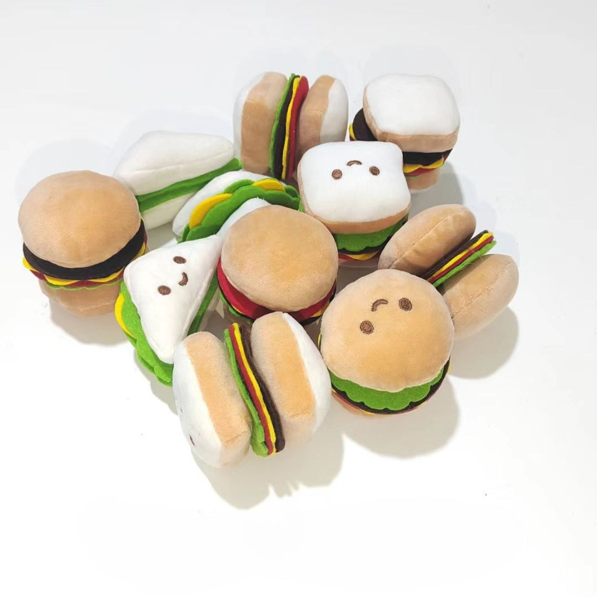 Moo plush food cat toy shaped like a smiling hamburger with lettuce and cheese details