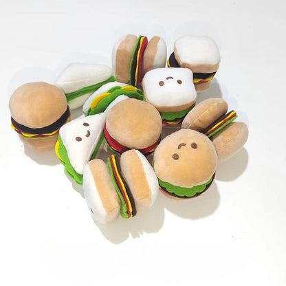Moo plush food cat toy shaped like a smiling hamburger with lettuce and cheese details