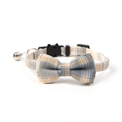 Close-up of Mokka checkered bow tie cat collar showing adjustable strap and breakaway clasp