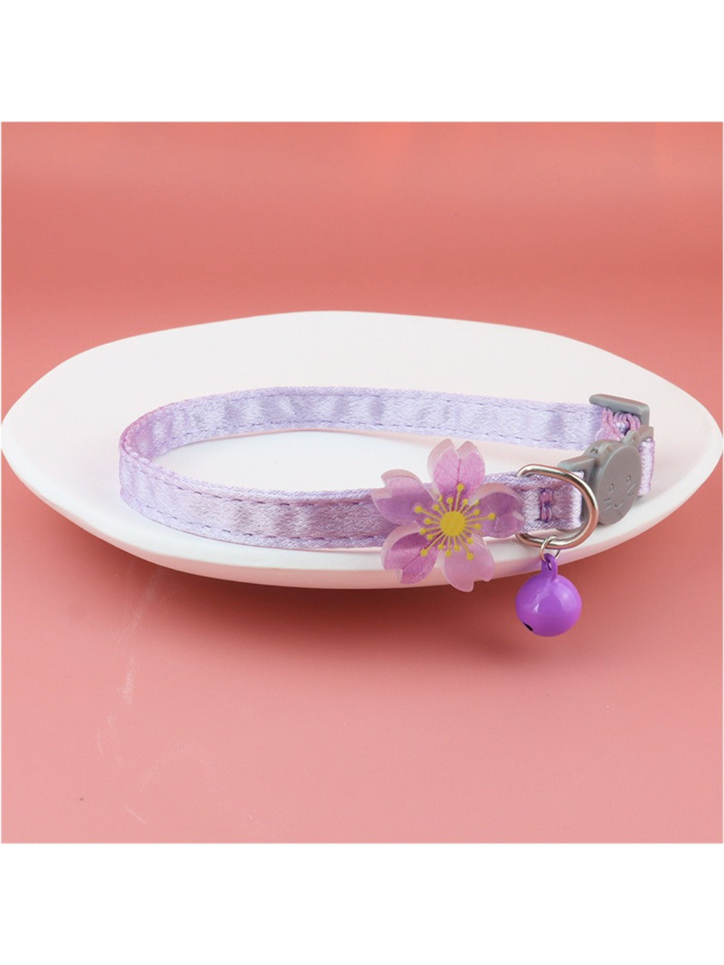 Mokka pastel flower bell cat collar laid flat with bell and buckle visible