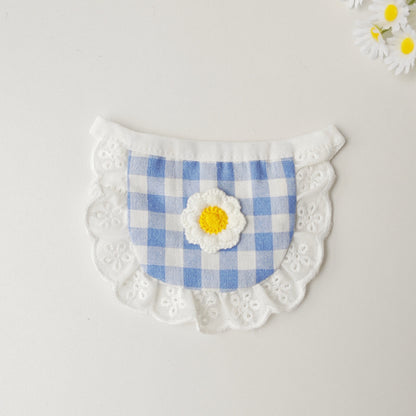Close-up of Mokka gingham daisy cat bib showing detailed fabric and flower design
