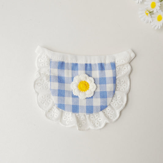 Close-up of Mokka gingham daisy cat bib showing detailed fabric and flower design