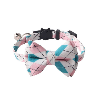Mokka Argyle bow tie cat collar shown from above on a wooden surface