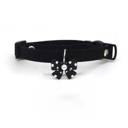 Close-up of the polka dot bow charm attached to the Mokka breakaway collar