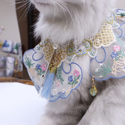 Detailed shot of floral embroidery on Mokka blossom collar with colorful threadwork