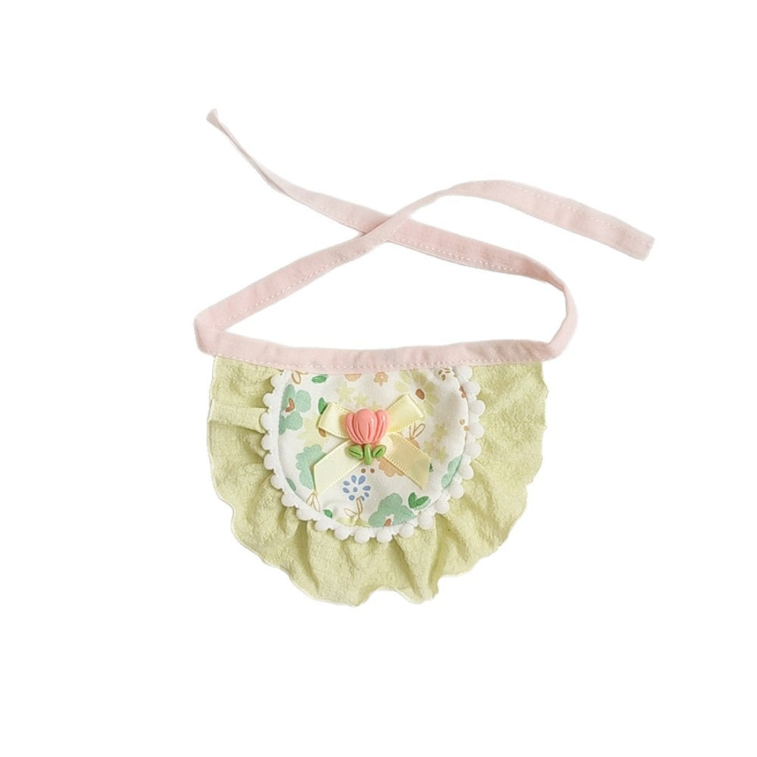 Cat wearing Mokka floral bow bib sitting on wooden floor